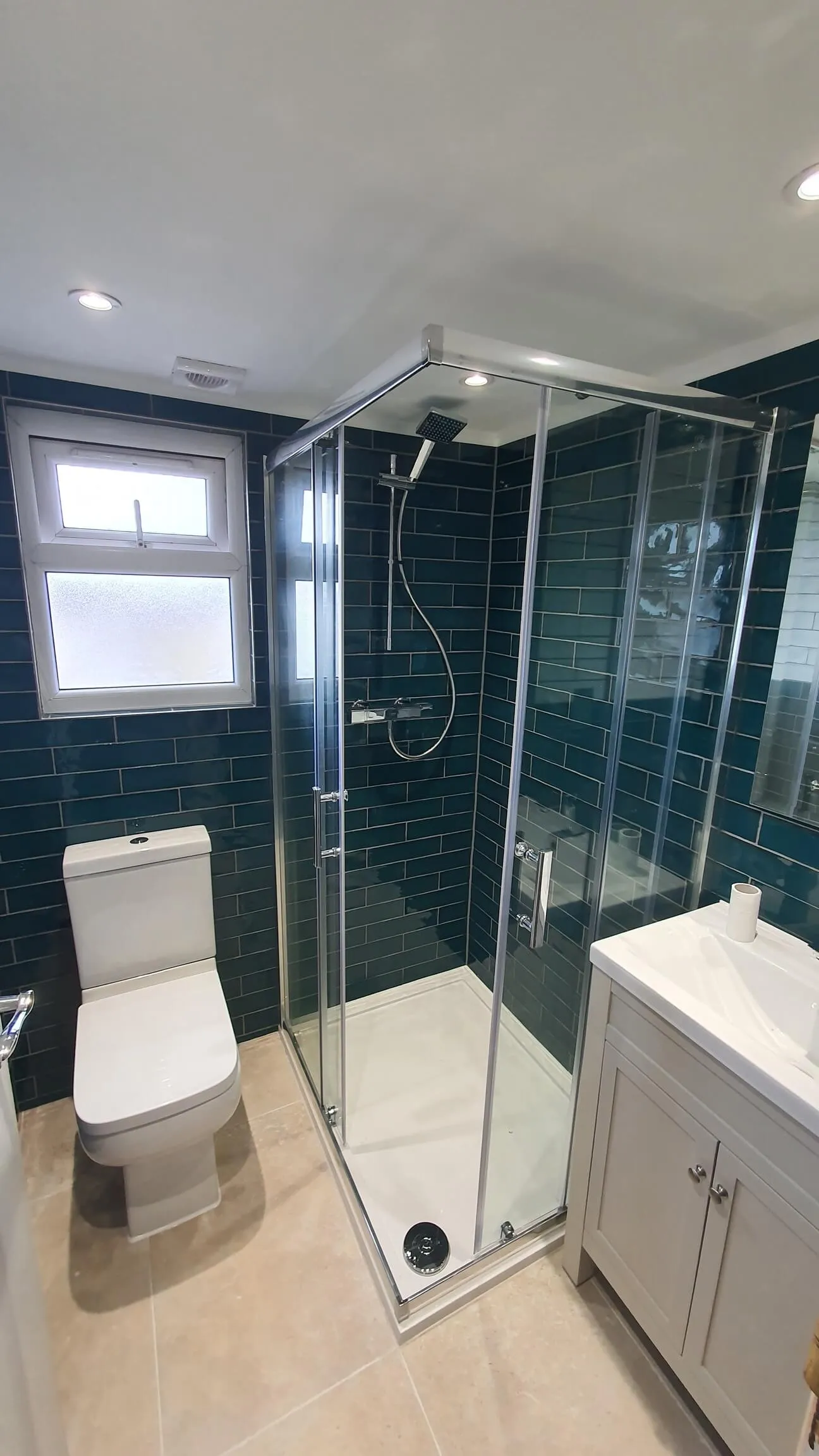 Walk-in shower enclosure with wall tiling